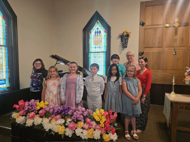 Inspirations Academy piano students posing together at their recital at a local church
