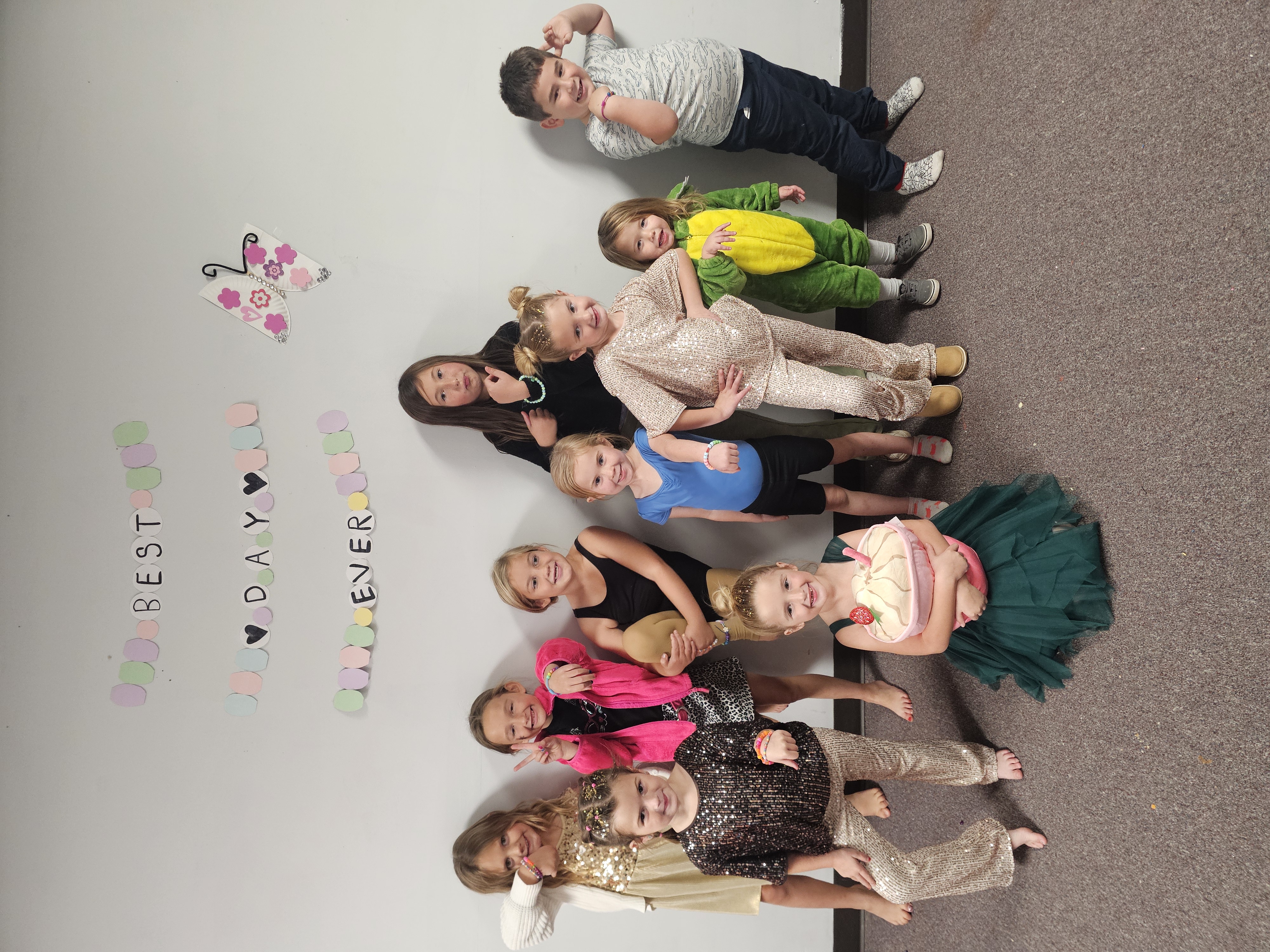 Kids celebrating and posing for a photo at a birthday party at Inspirations Academy