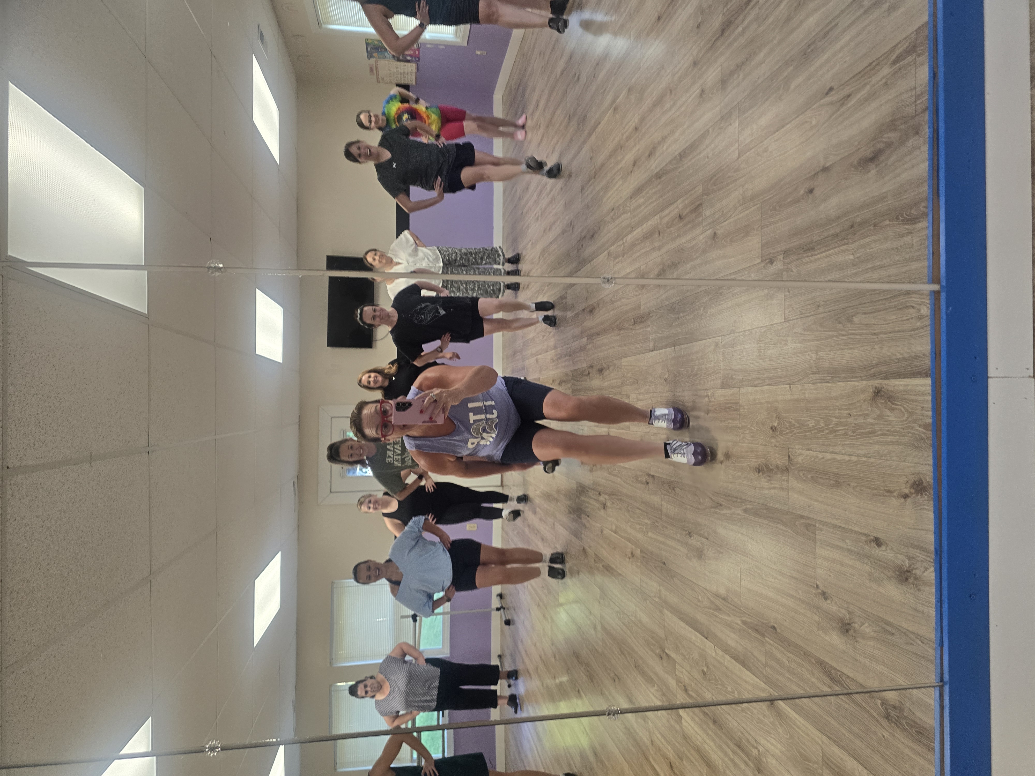Adult tap students practicing together in the studio.