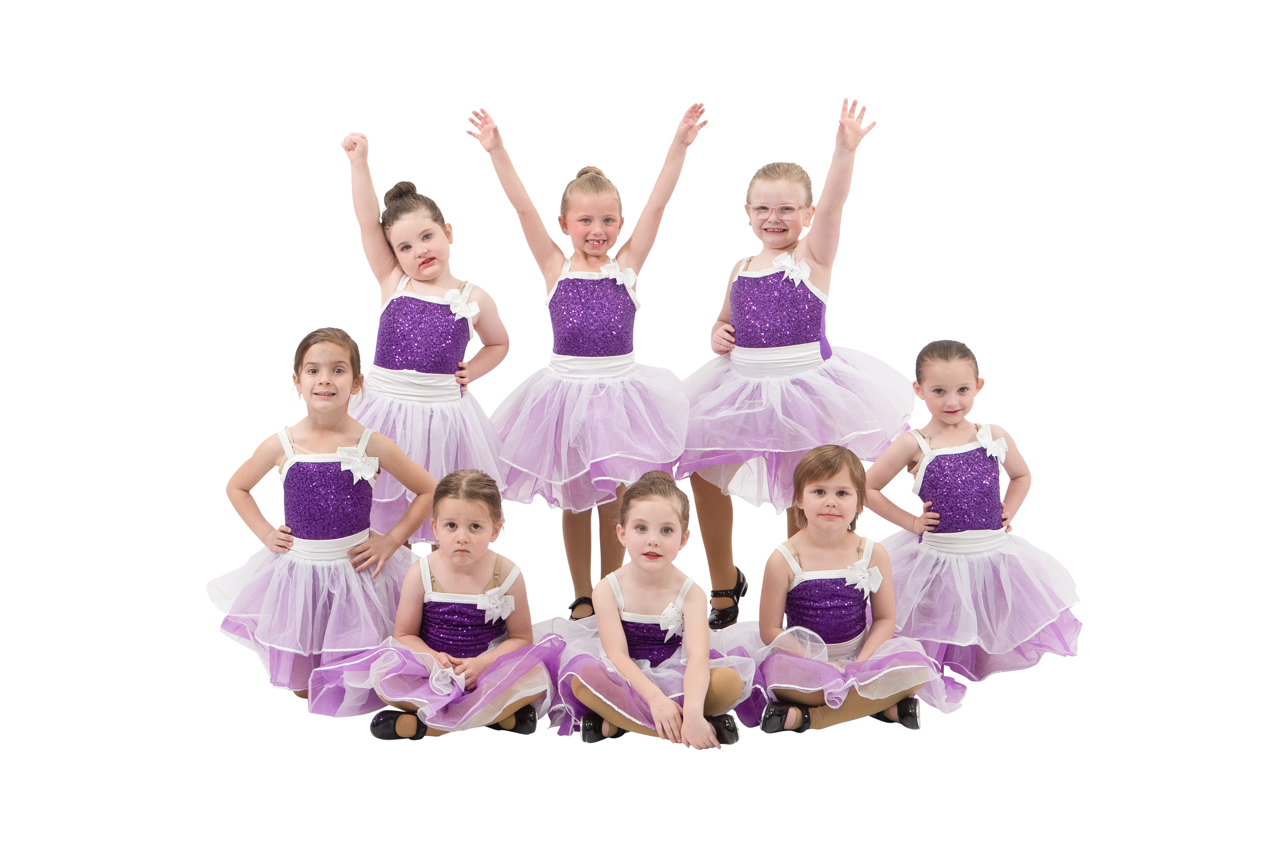 The Little Dancers B group posing in purple recital costumes.