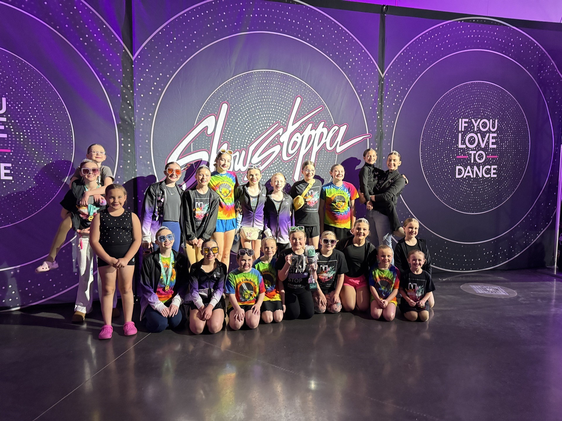 A group of Inspirations Academy dancers celebrating together at the Showstoppa dance competition.